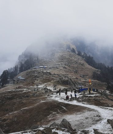 Explore the stunning Triund hike in winter mist. Perfect for adventure travel in Dharamshala, India.