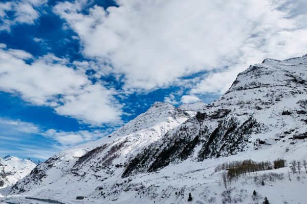 A breathtaking aerial shot of the snow-covered Himalayan mountains in Himachal Pradesh, India.