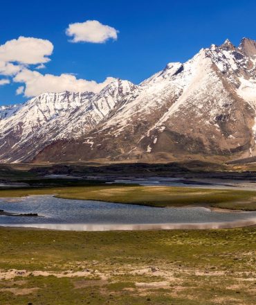 Majestic snow-capped mountains and green valleys in Kargil, Ladakh.
