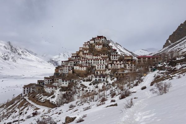 Stunning winter landscape of Kibber Village nestled in the snowy mountains of Himachal Pradesh, India.