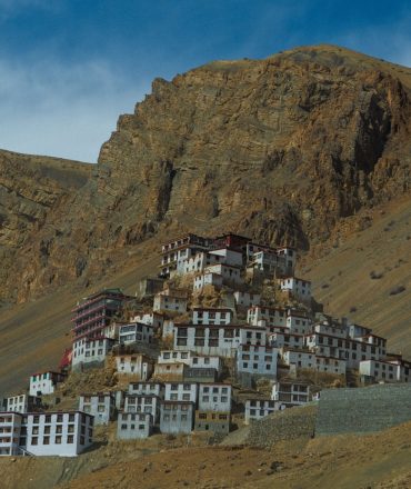 Key Monastery nestled in the rugged hills of Spiti Valley, showcasing stunning Buddhist architecture.